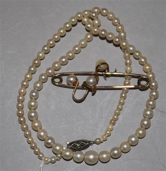 A cultured pearl necklace, a pair of earring and a bar brooch.